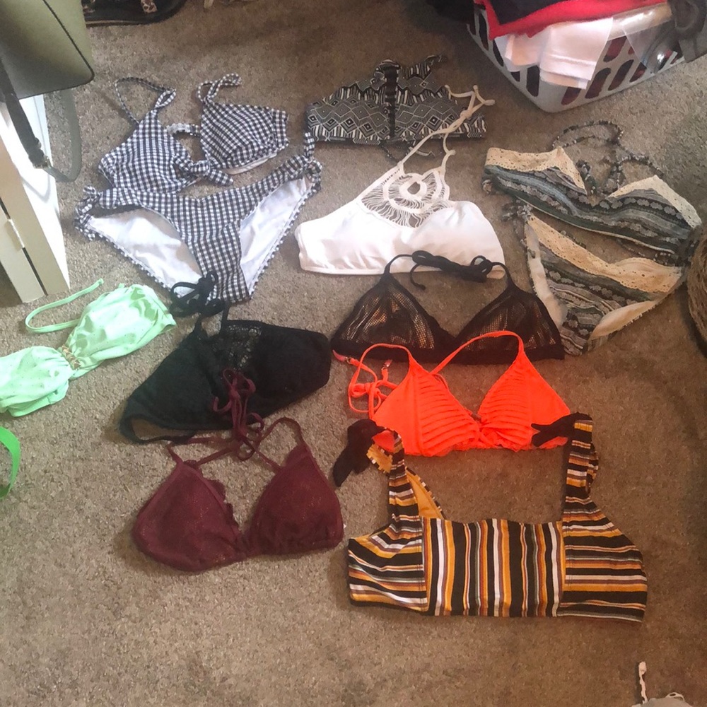 A variety of bikini top and bottoms. Lightly worn